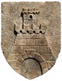 Coat of arms in stone fortress with tower